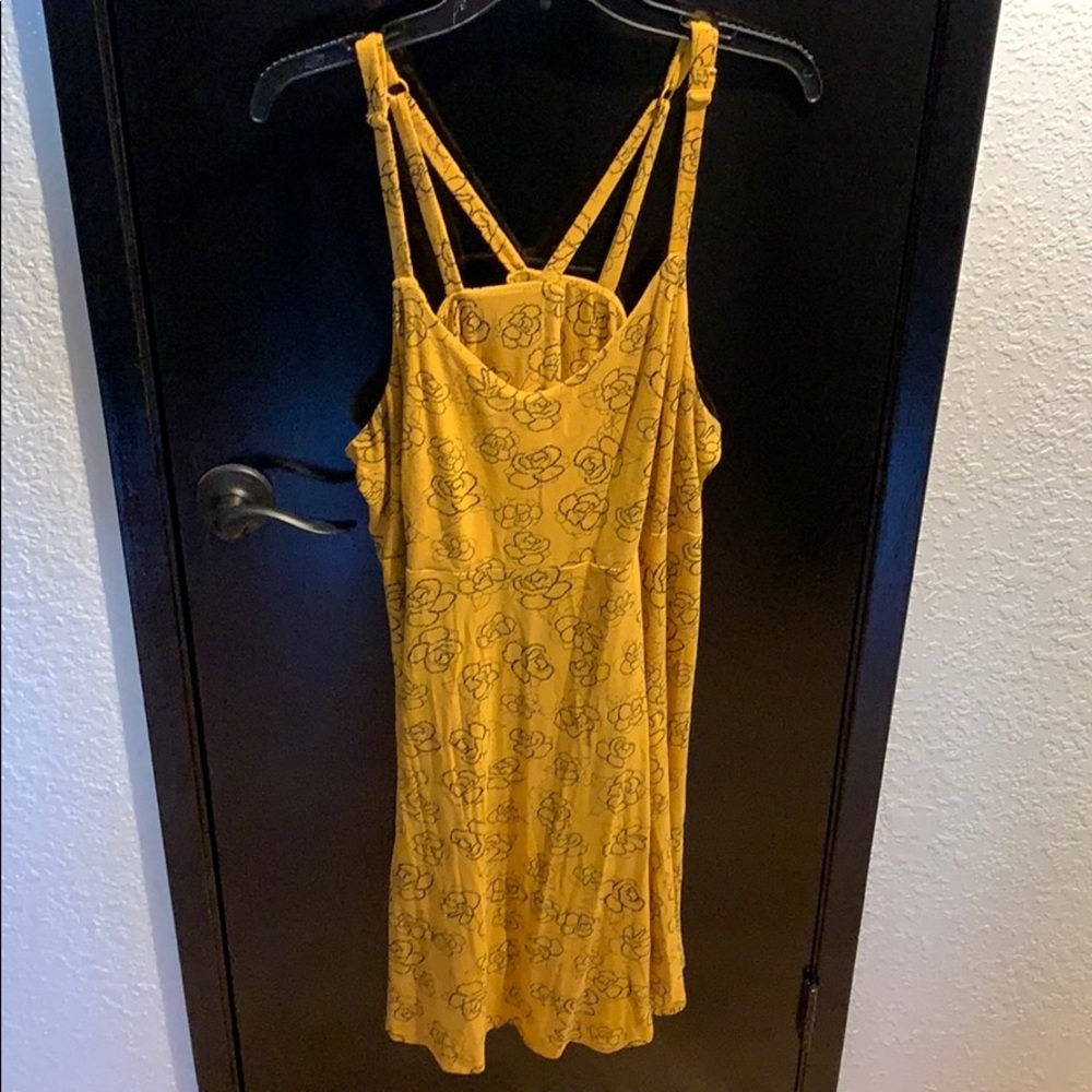 Mustard yellow dress with flowers.
